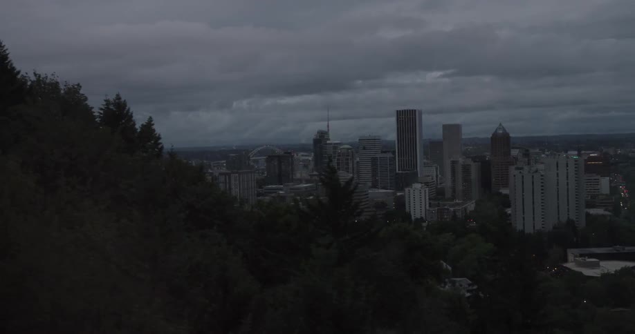 Clouds float over city skyscrapers