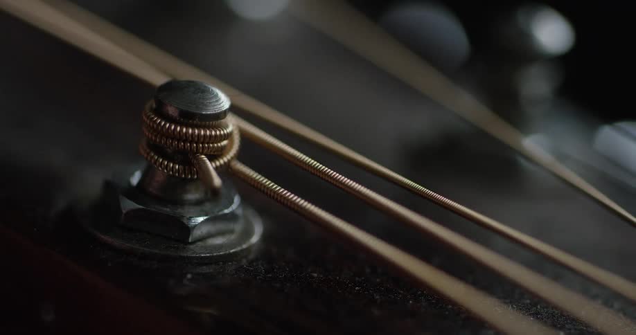 A guitar string is tightened