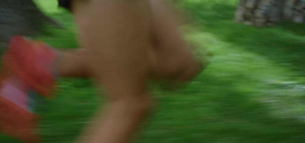 A man is running through the park