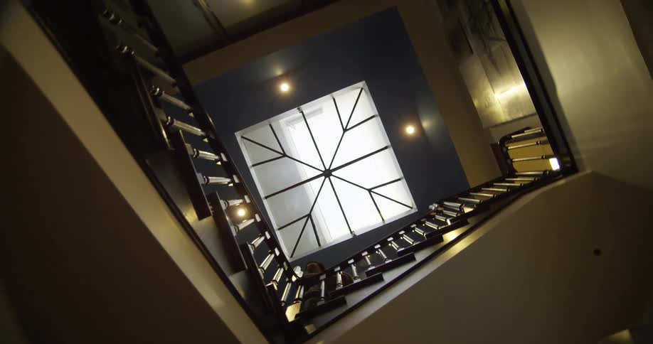 A person walking down stairs in a building