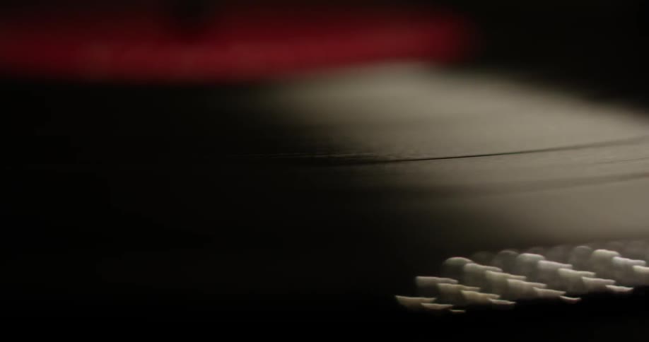 Close up of a record turning on a record player