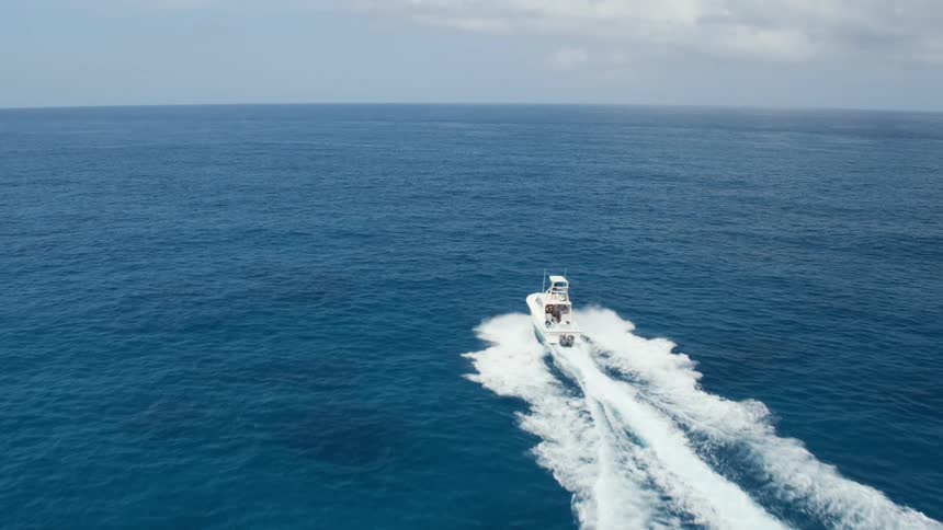 A boat is moving through the ocean water