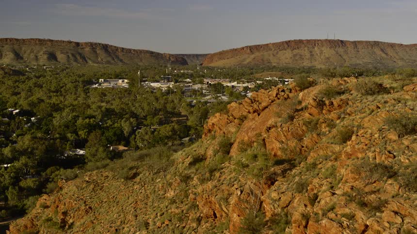 A town sits between the mountains