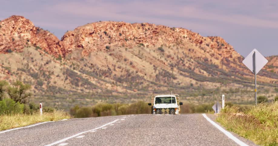 A truck driving down a road