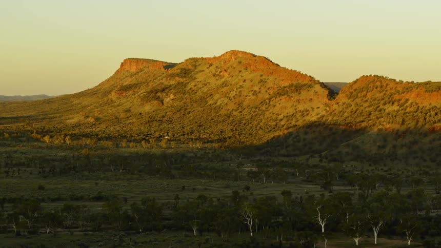 A mountain range and vegetation in the wilderness