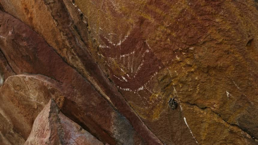 A red and brown rock wall