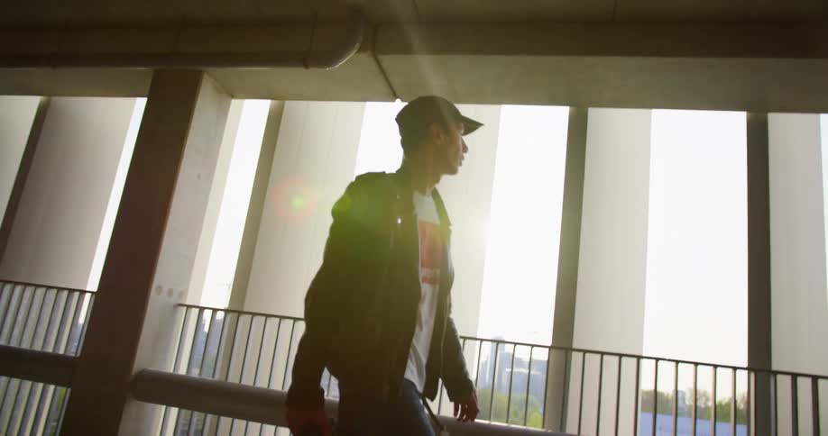 A teenager walking down a corridor