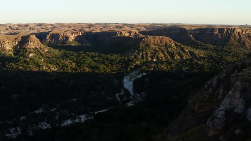 A river flows through a canyon in the wilderness