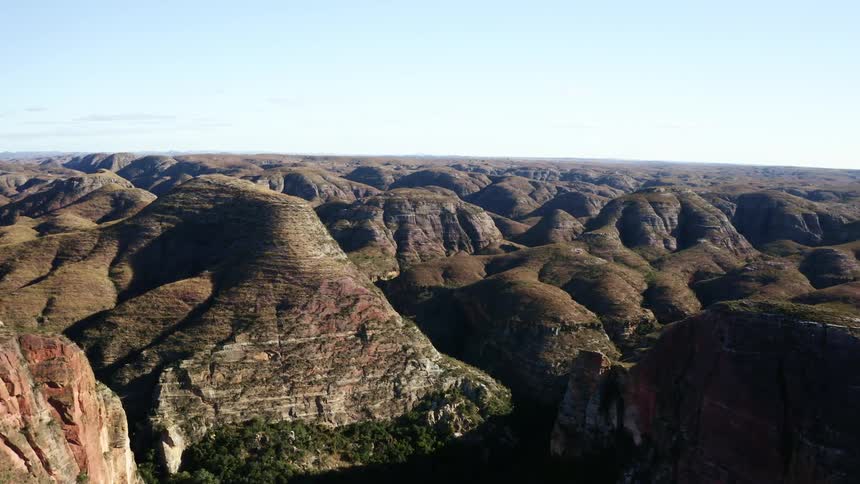 Aerial view of a landscape with hills and canyons