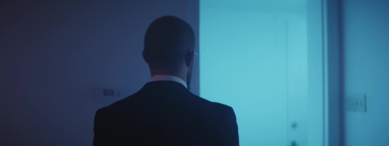 A man is walking through a house
