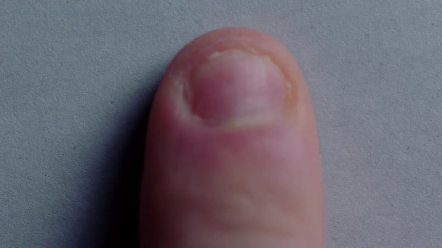 A fingerprint is made in ink on a piece of paper