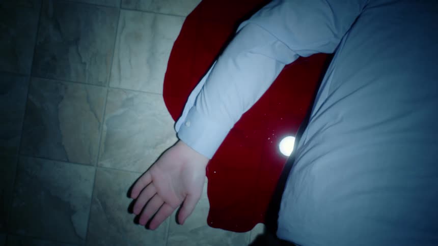 A man is laying in a pool of blood
