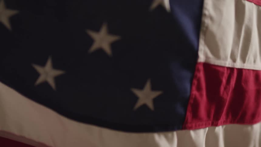 Close up of an american flag waving in the wind
