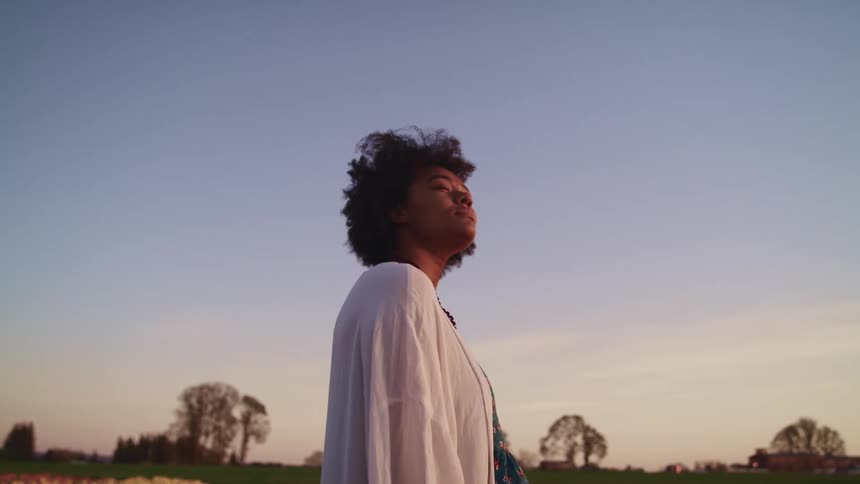 A woman standing in a field