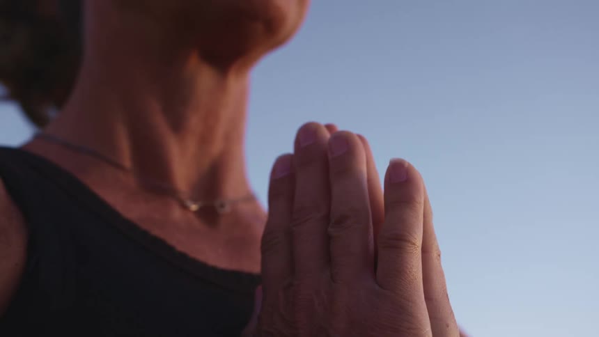 A woman praying outside