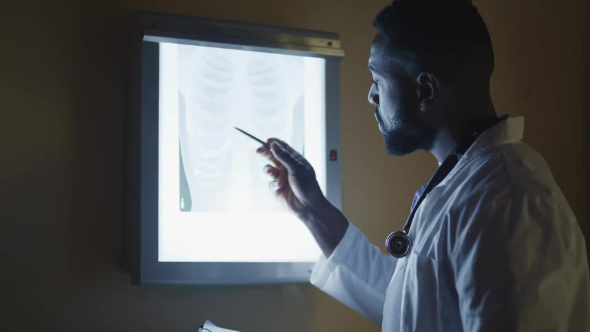 A doctor looking at an x ray