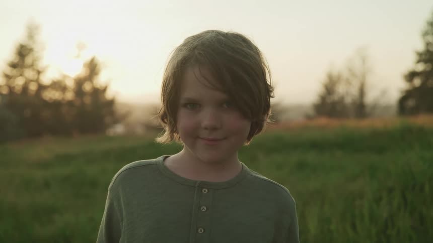A child outside on a lawn