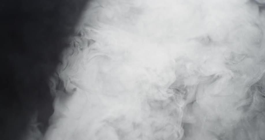 Smoke billows upward and joins into large cloud