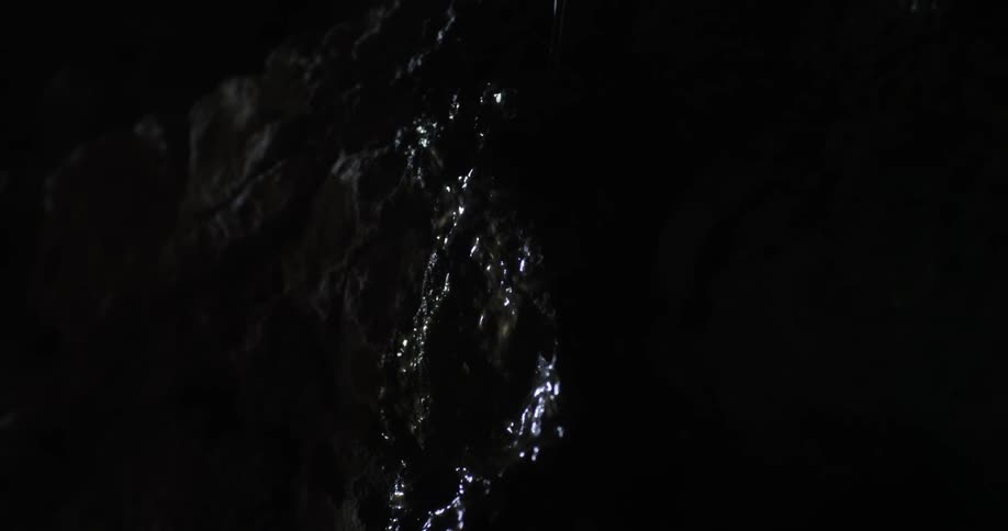 Water flows down a rocky wall