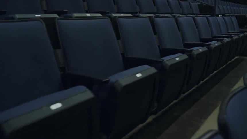 The theater has rows of many seats