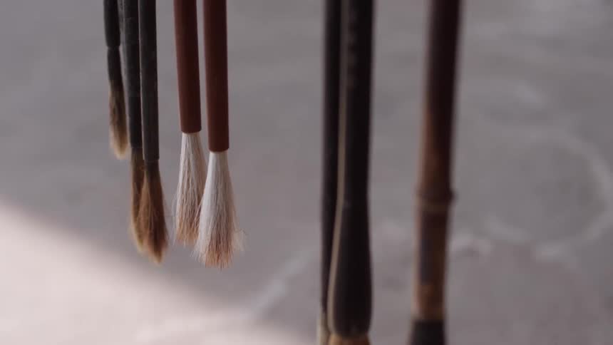 The brushes are waving around as they hang