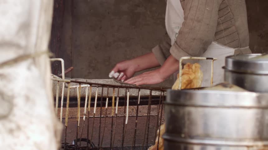 A man in a restaurant cooking