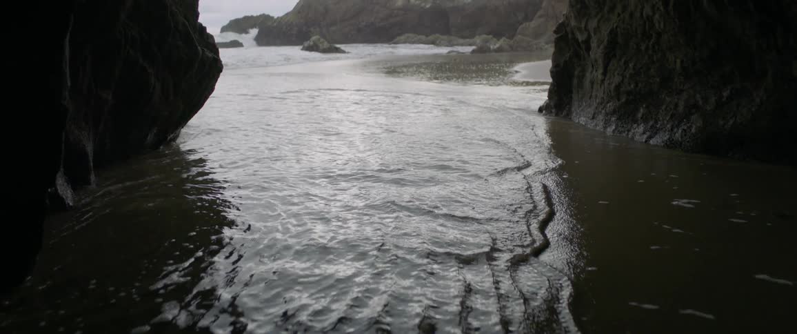 Ocean waves wash ashore a beach