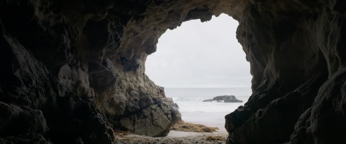 A view from a cave overlooking the ocean