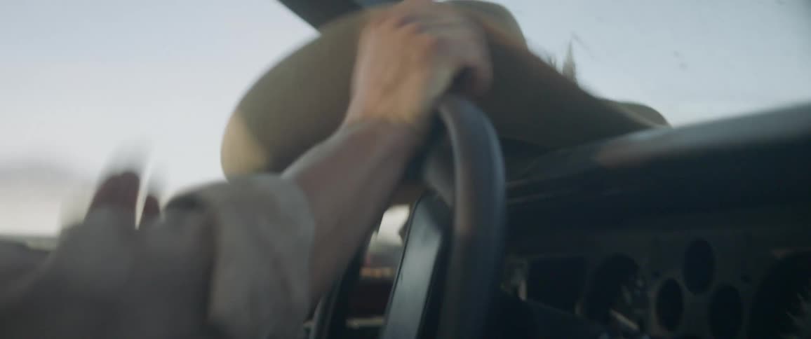 Person turns the steering wheel of a vehicle