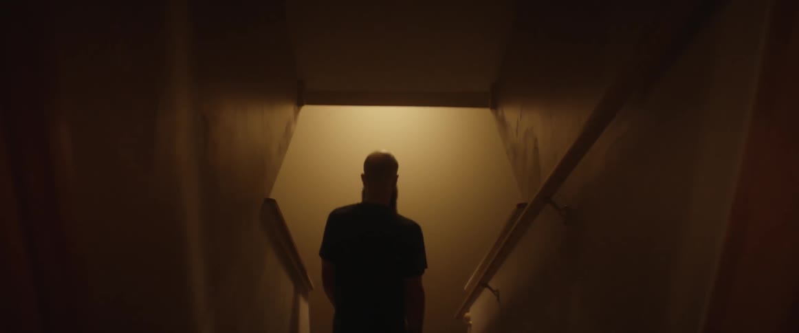 A man descends a staircase