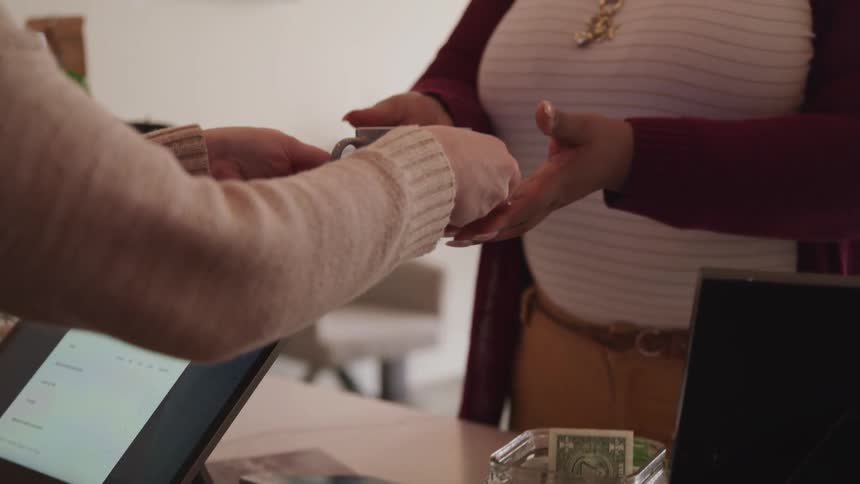 A person is served a cup of coffee