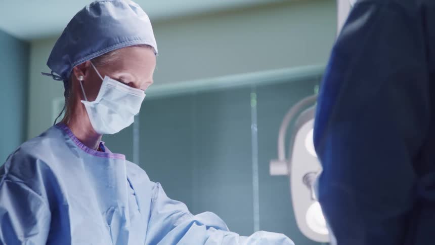 Surgical team operates in the operating room