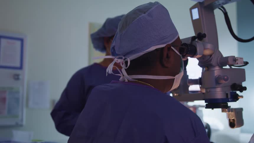 Two doctors work in the operating room