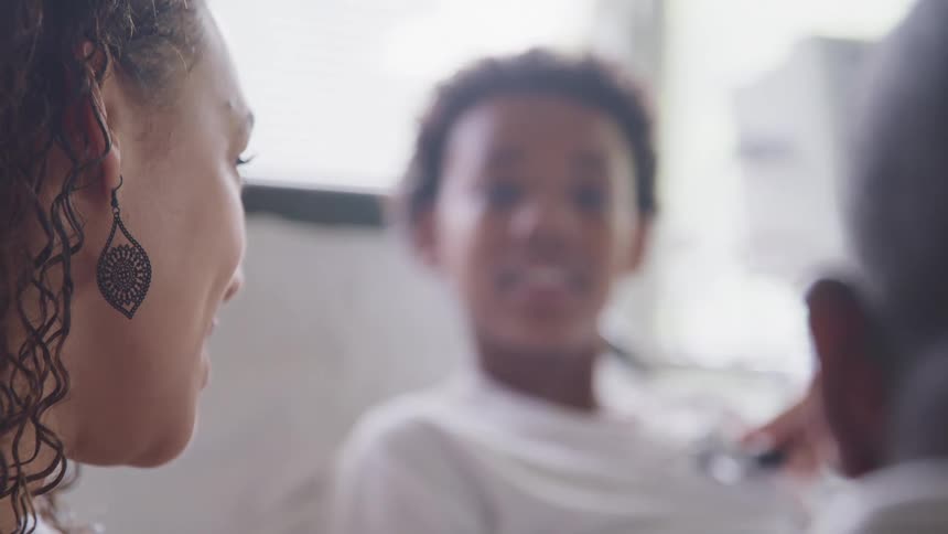 A patient is being examined in the hospital room