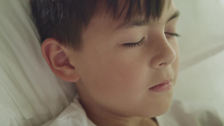 A young boy sleeping