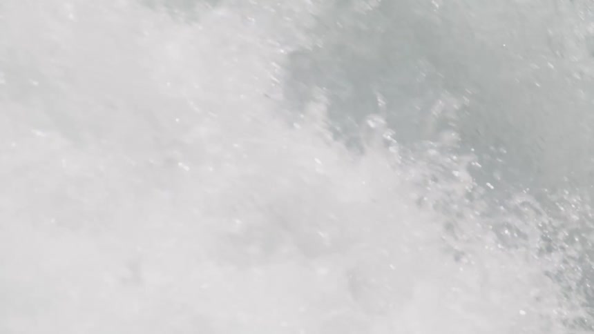 A waterfall with water and water droplets