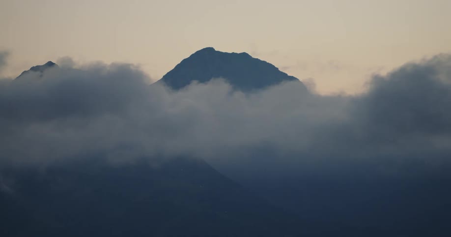 An aerial view of a mountain is displayed