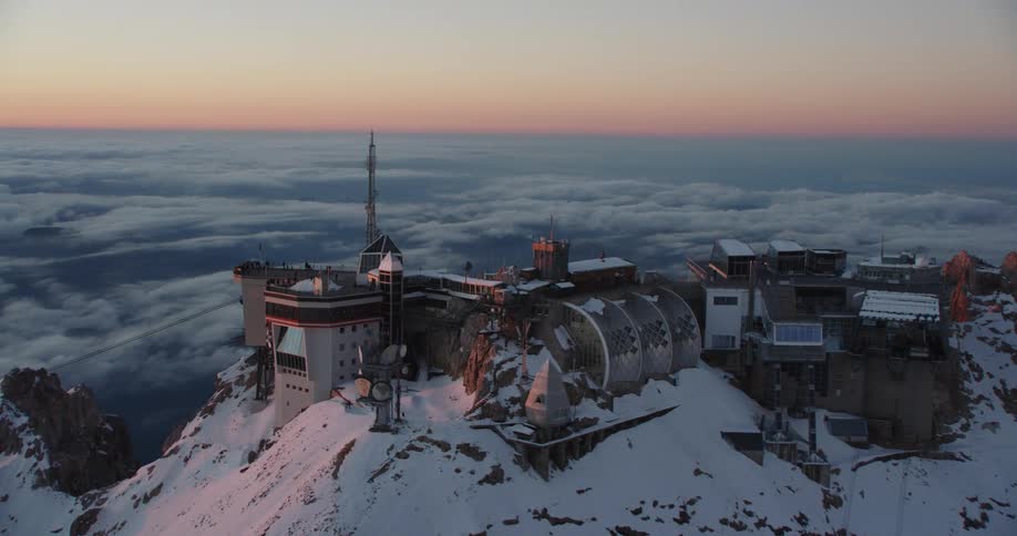 A large resort is on the mountain top