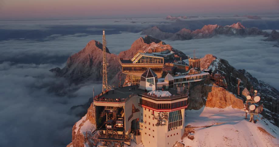 People on top of an observatory on a mountain top