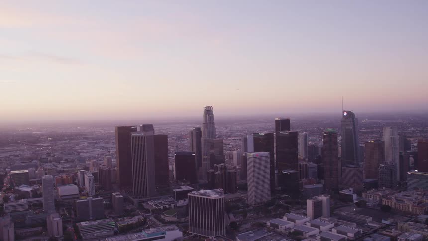 An aerial view of a downtown city is displayed