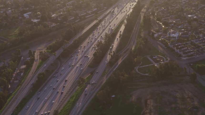 Cars traveling on a freeway in a city in the daytime