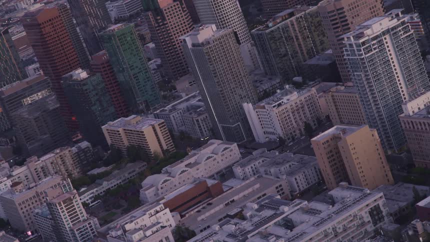 Aerial view of buildings in the citys downtown at sunset