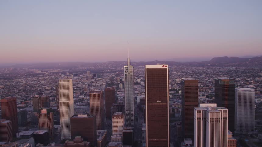 Skyscrapers in a city at sunrise