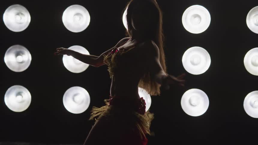 A woman is dancing indoors