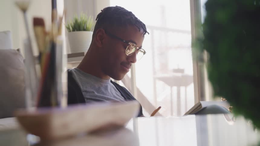 A man sitting at home reading