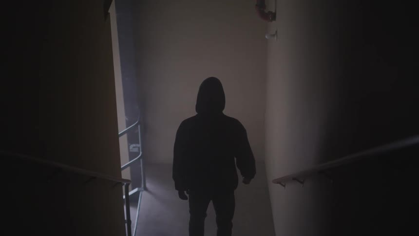 A man walking down a staircase