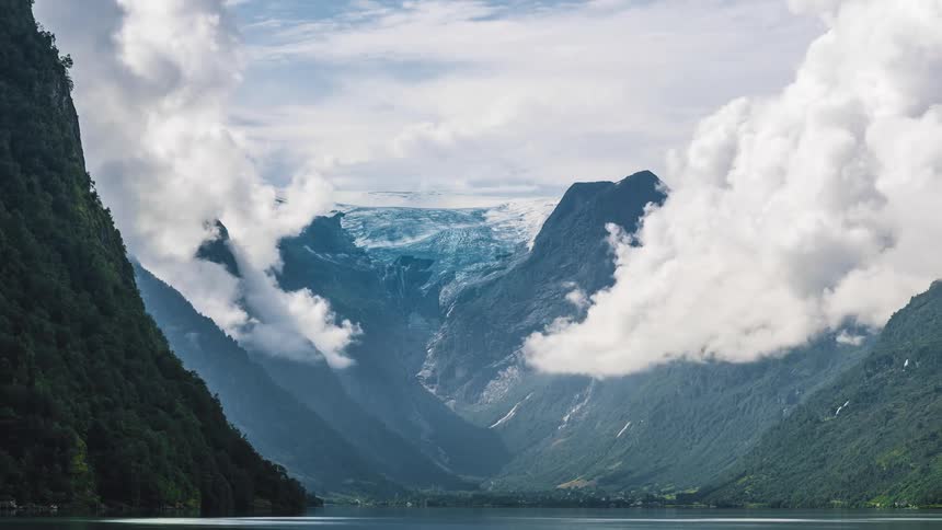Cloud formations above a mountain lake in the daytime