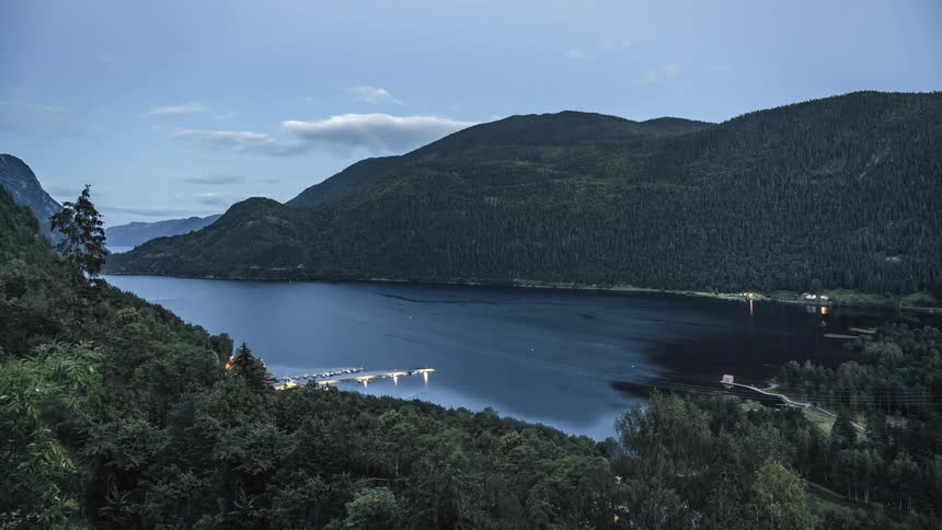 Wind blows over water on a mountain lake on a summer day