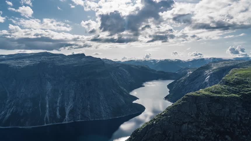 An aerial view of a mountain is displayed