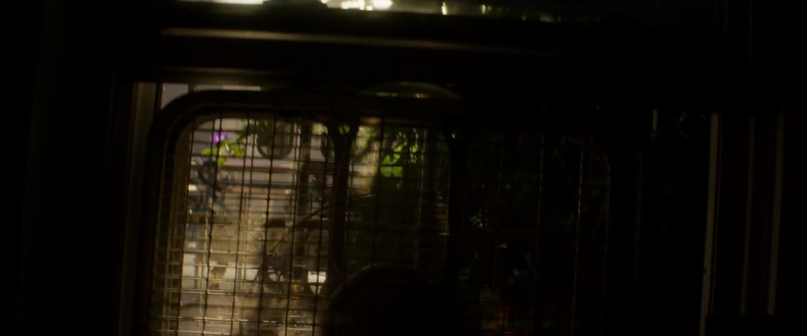 A fan sits in an open window
